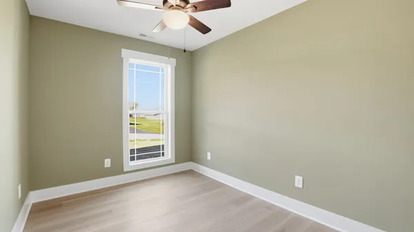 a bathroom with a granite countertop sink a mirror a bathtub and shower