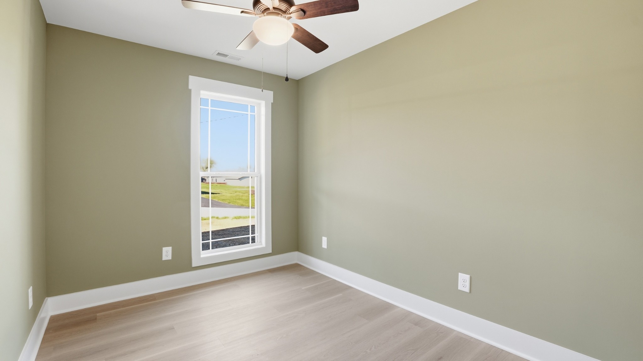 104 Division Street Normandy, TN 37360 - Photo 23 of 48 an empty room with a window and a ceiling fan