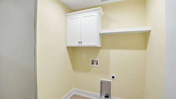 a view of a room with wooden floor and small space