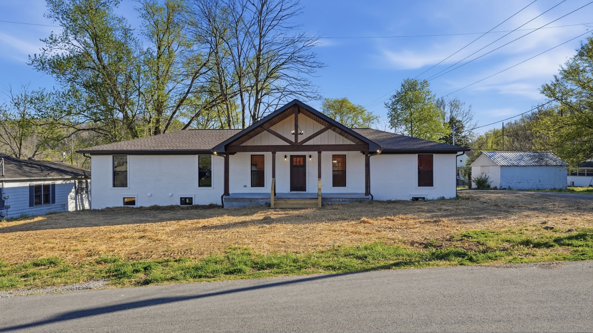 104 Division Street Normandy, TN 37360 - Photo 3 of 48 a front view of house with yard and trees around