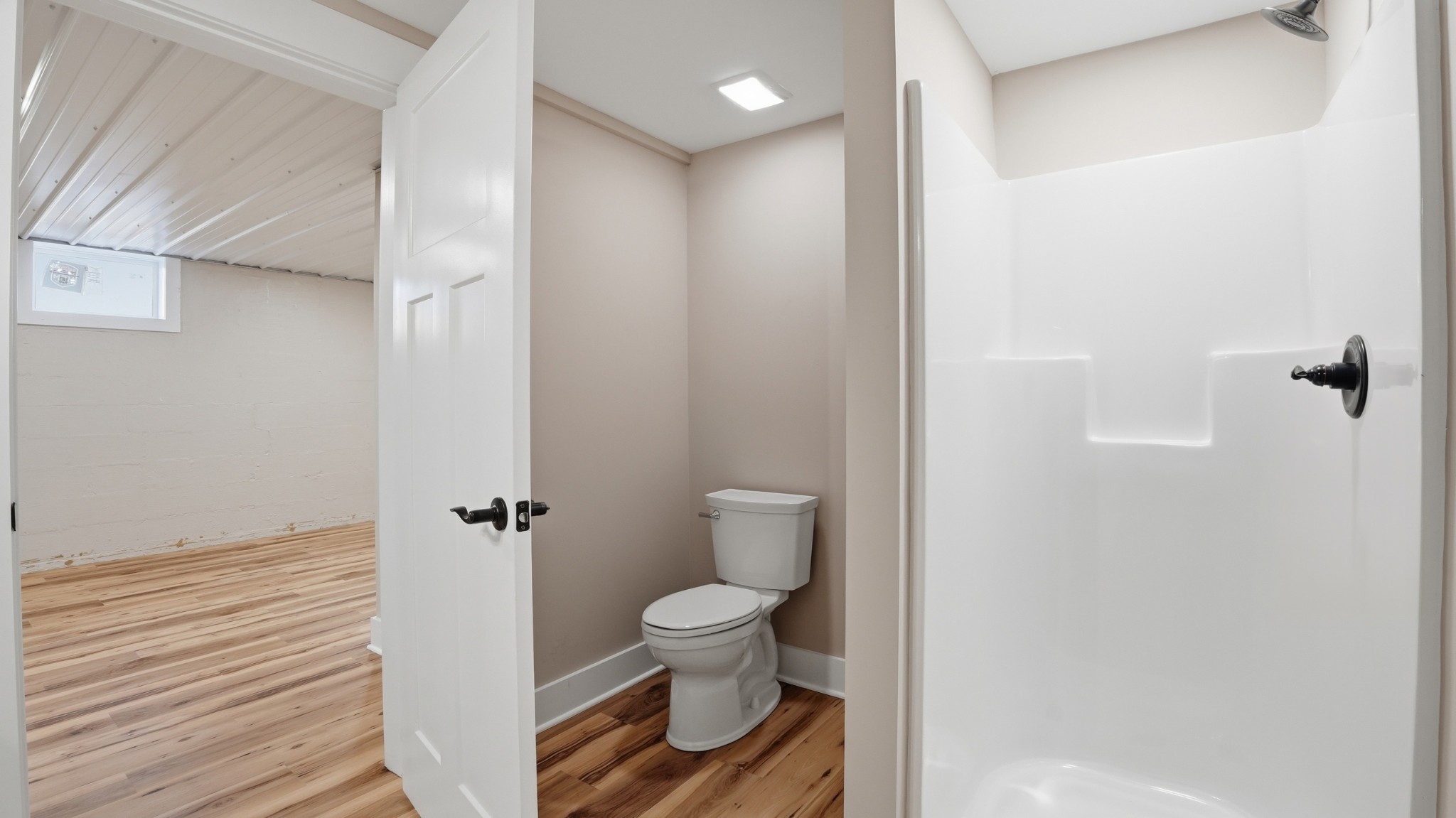 104 Division Street Normandy, TN 37360 - Photo 32 of 48 a bathroom with a toilet and a shower