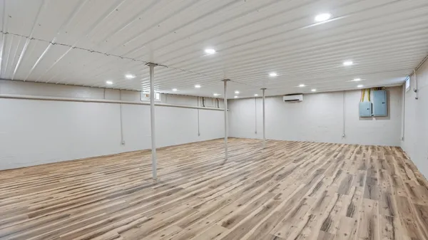 a view of a room with a wooden floor