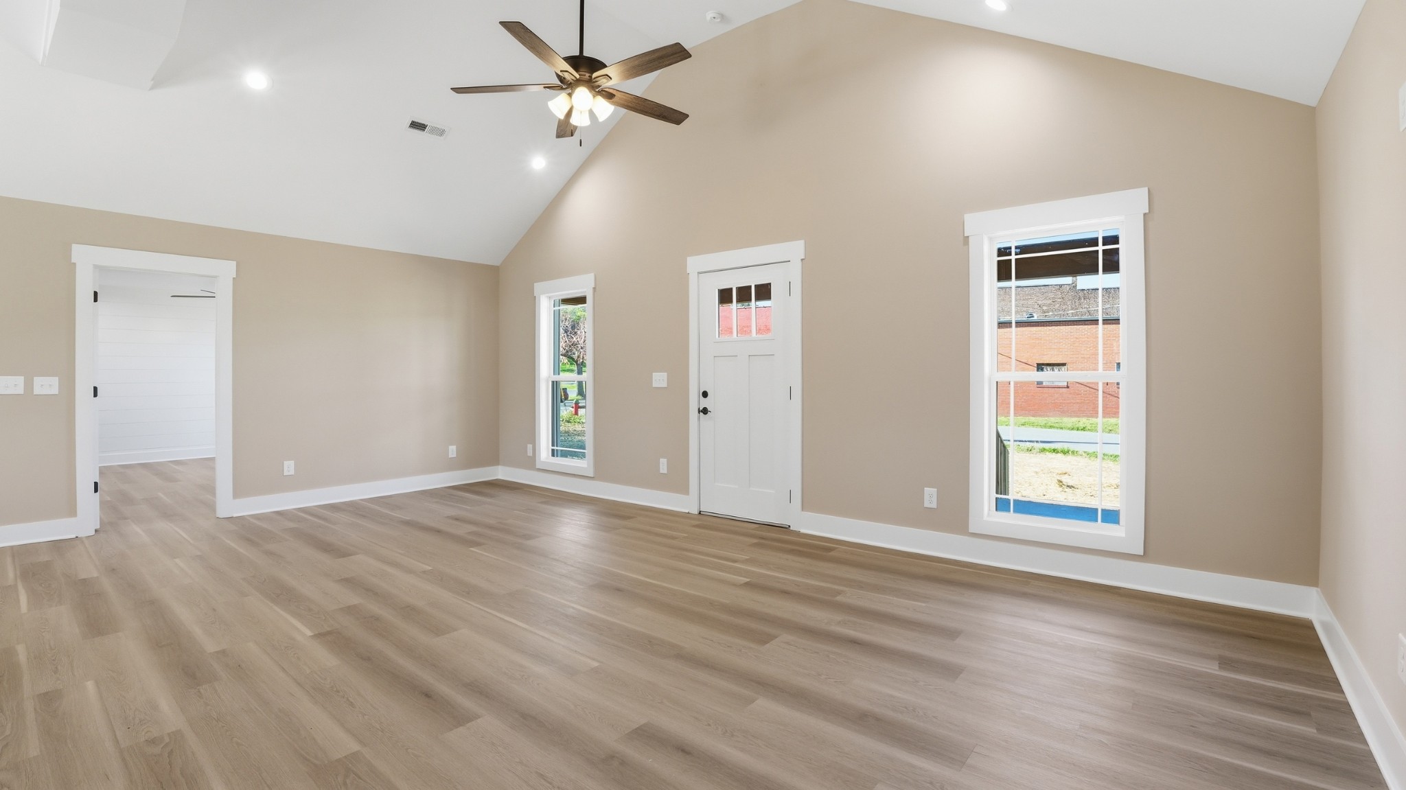 104 Division Street Normandy, TN 37360 - Photo 5 of 48 a view of an empty room with a window and wooden floor