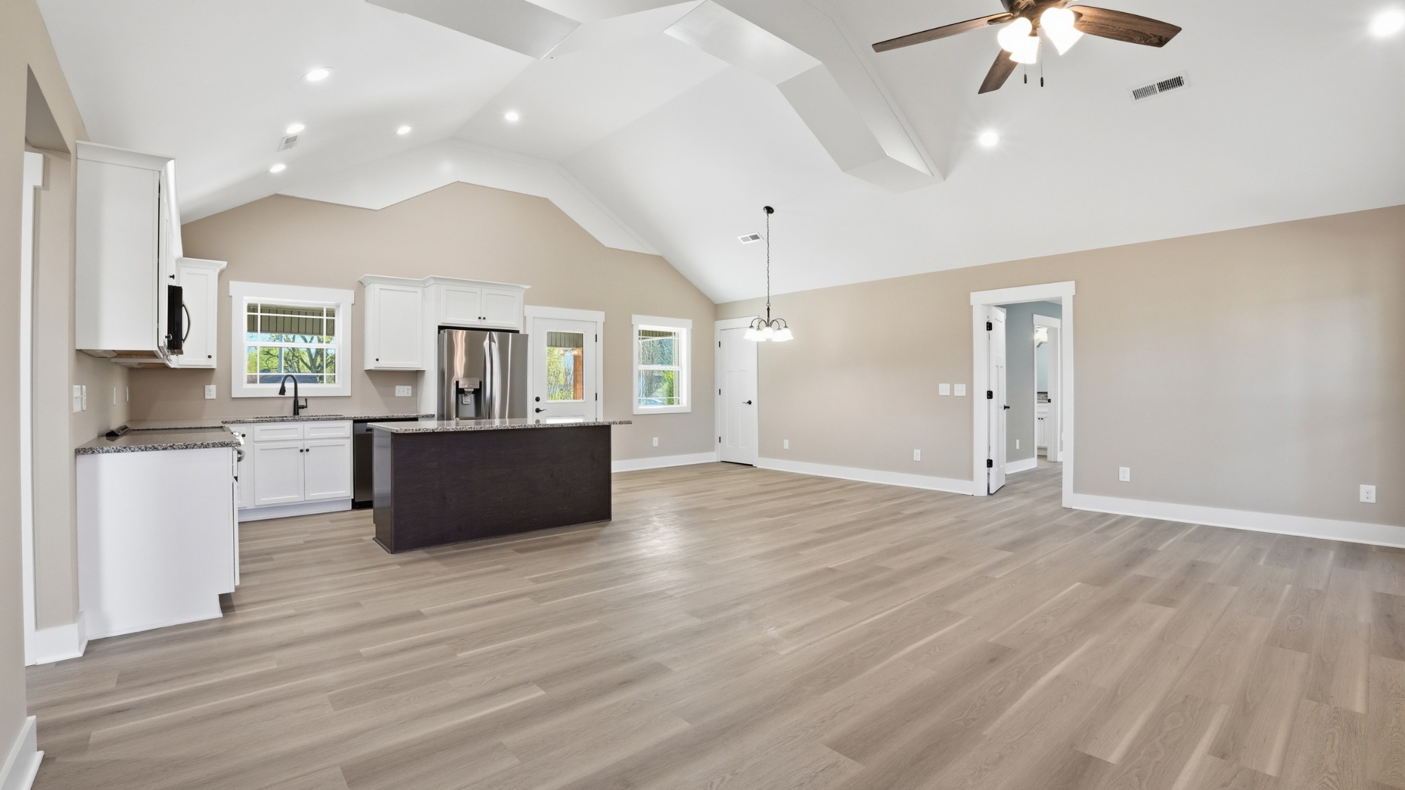 104 Division Street Normandy, TN 37360 - Photo 8 of 48 a large room with wooden floor and a chandelier
