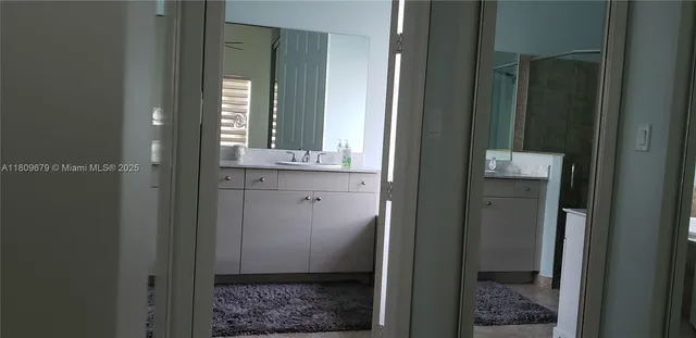 a bathroom with a mirror