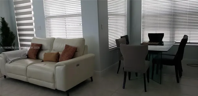 a living room with furniture and a window