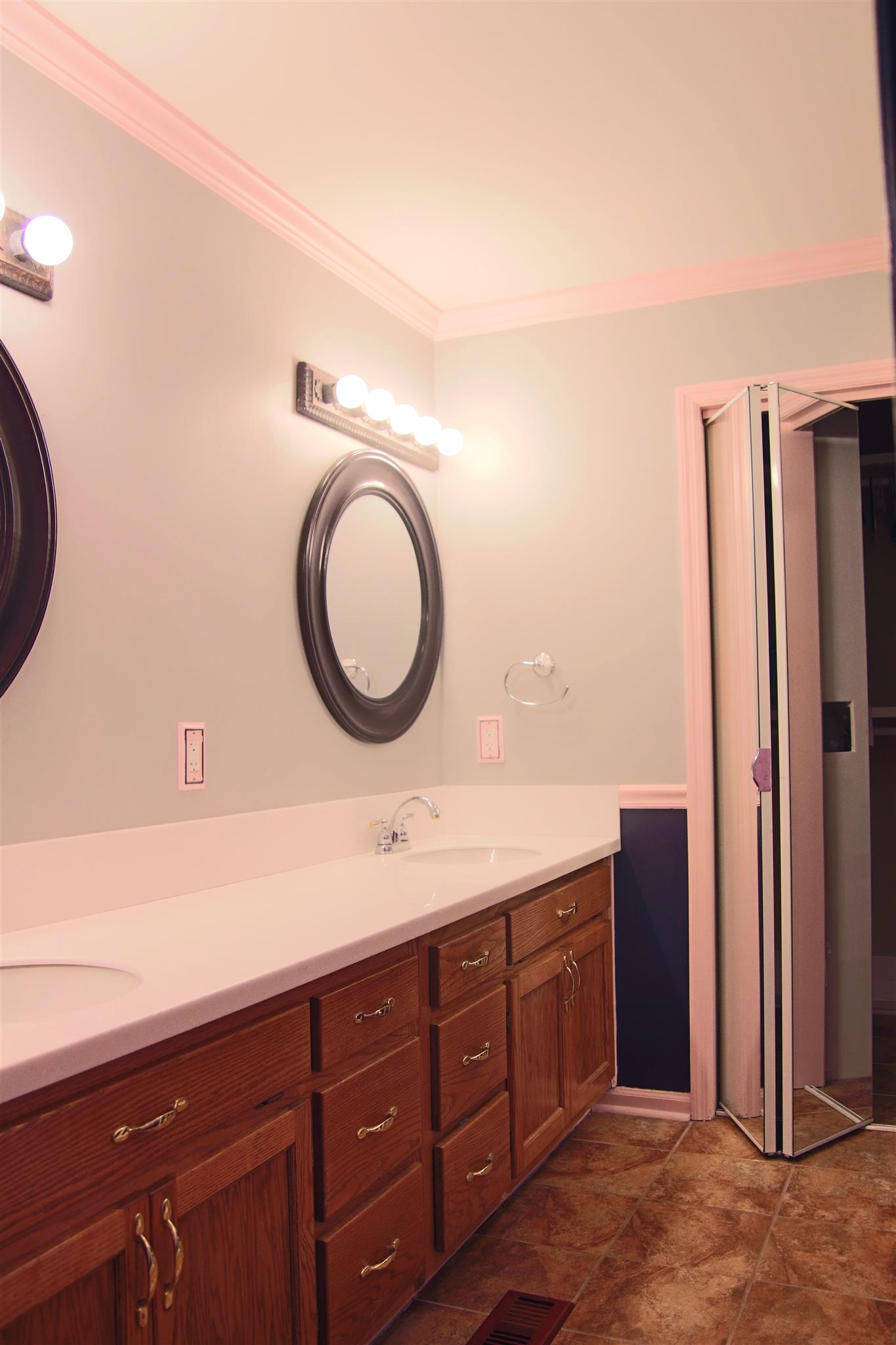 39 Smoke Rise Circle Manchester, TN 37355 - Photo 16 of 29 a bathroom with a double vanity sink and a mirror