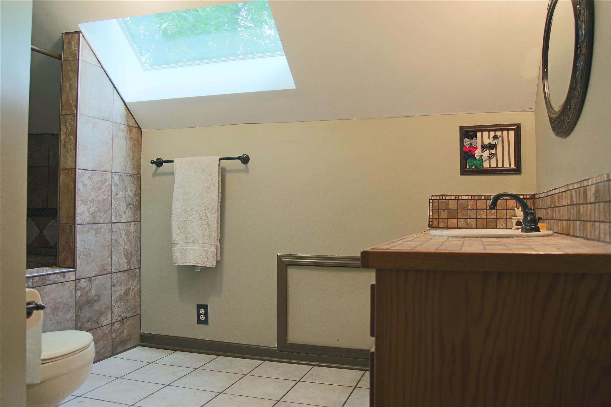 39 Smoke Rise Circle Manchester, TN 37355 - Photo 22 of 29 a bathroom with a sink a toilet and shower
