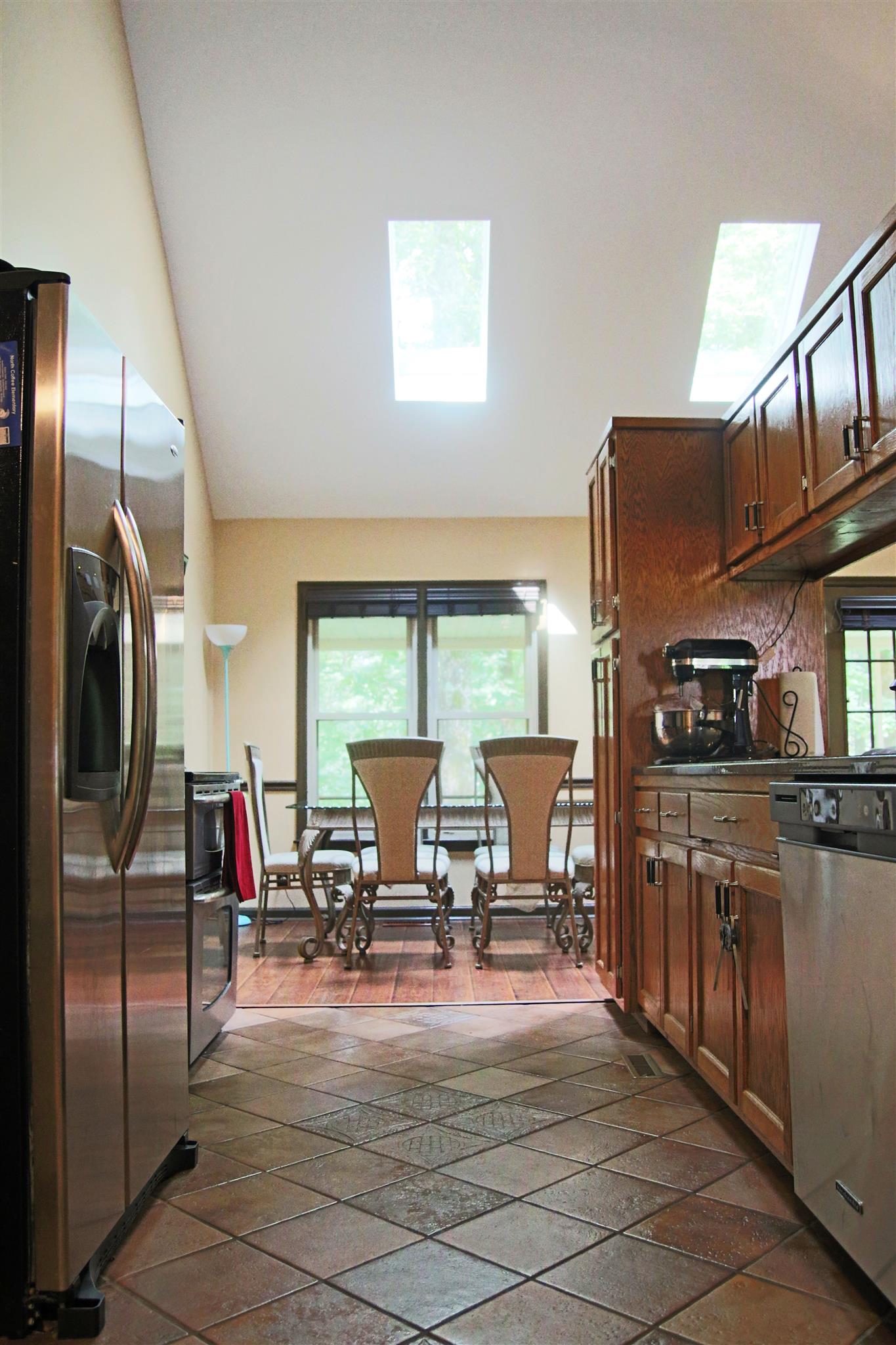 39 Smoke Rise Circle Manchester, TN 37355 - Photo 7 of 29 a living room with stainless steel appliances furniture a rug and a kitchen