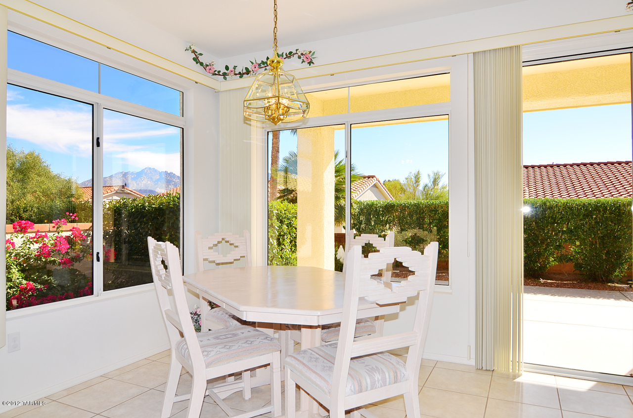 1330 East Crown Ridge Drive Tucson, AZ 85755 - Photo 6 of 22 a view of a dining room with furniture window and outside view