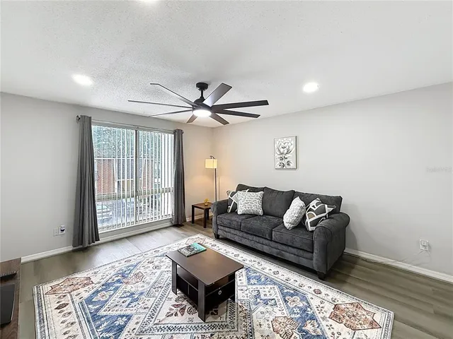 a living room with furniture and a rug