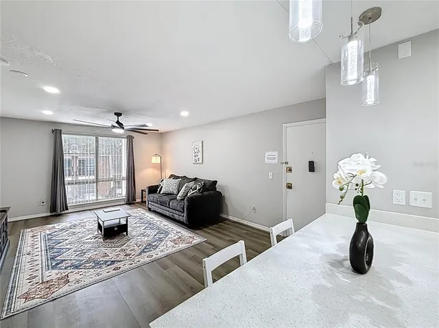 a living room with furniture flowers