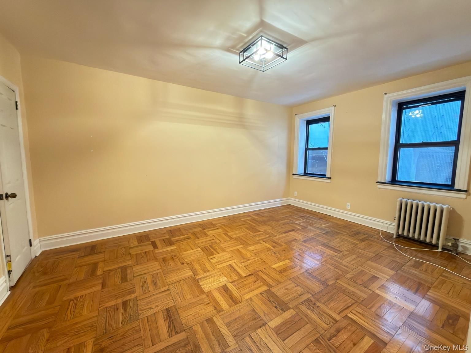 42 Barker Avenue, Unit 2B White Plains, NY 10601 - Photo 7 of 13 Spare room with radiator and baseboards