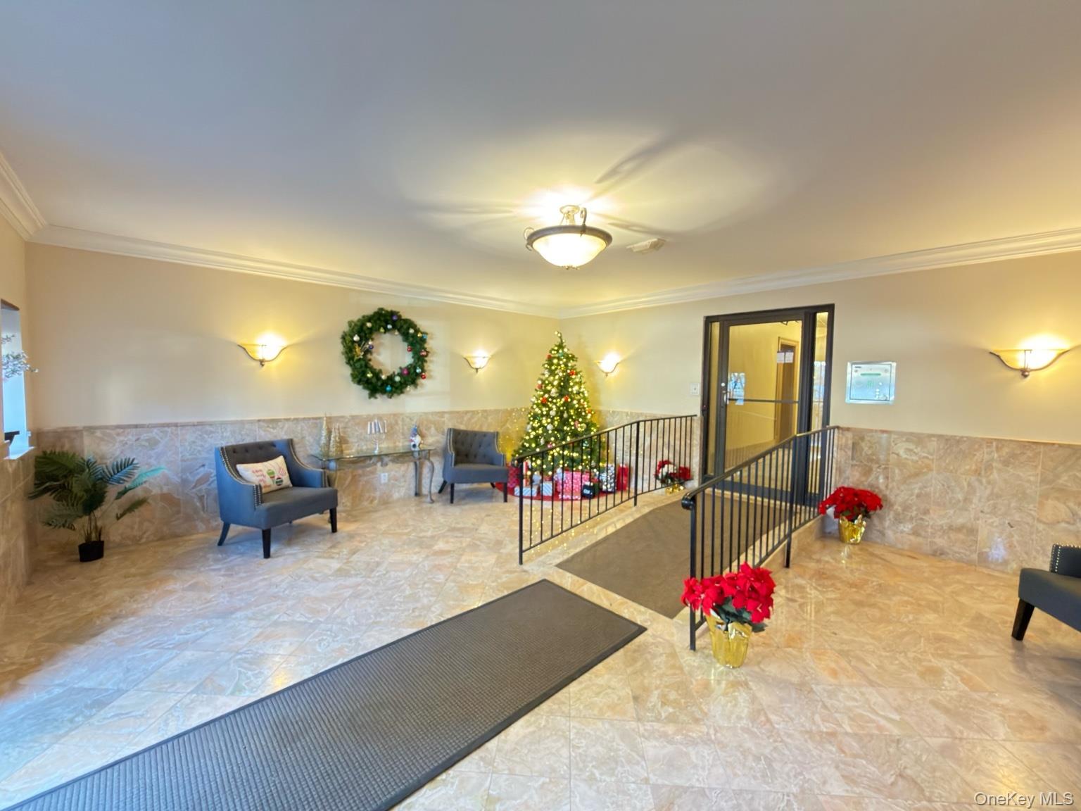 42 Barker Avenue, Unit 2B White Plains, NY 10601 - Photo 10 of 13 Lobby with a wainscoted wall, crown molding, and tile walls