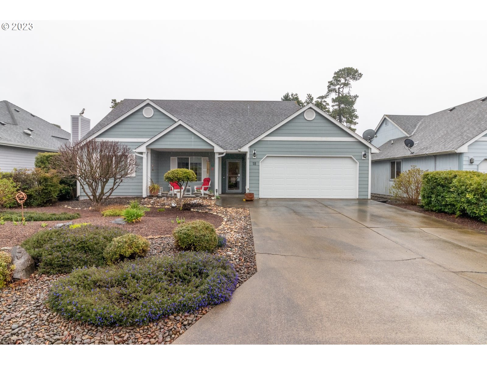a front view of a house with garden