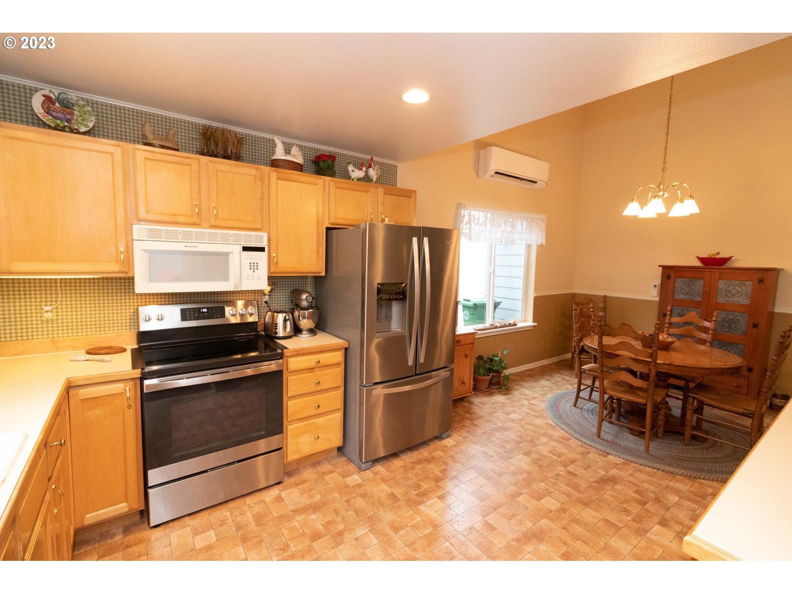 18 Mariners Lane Florence, OR 97439 - Photo 11 of 28 a kitchen with stainless steel appliances granite countertop a refrigerator and a stove top oven