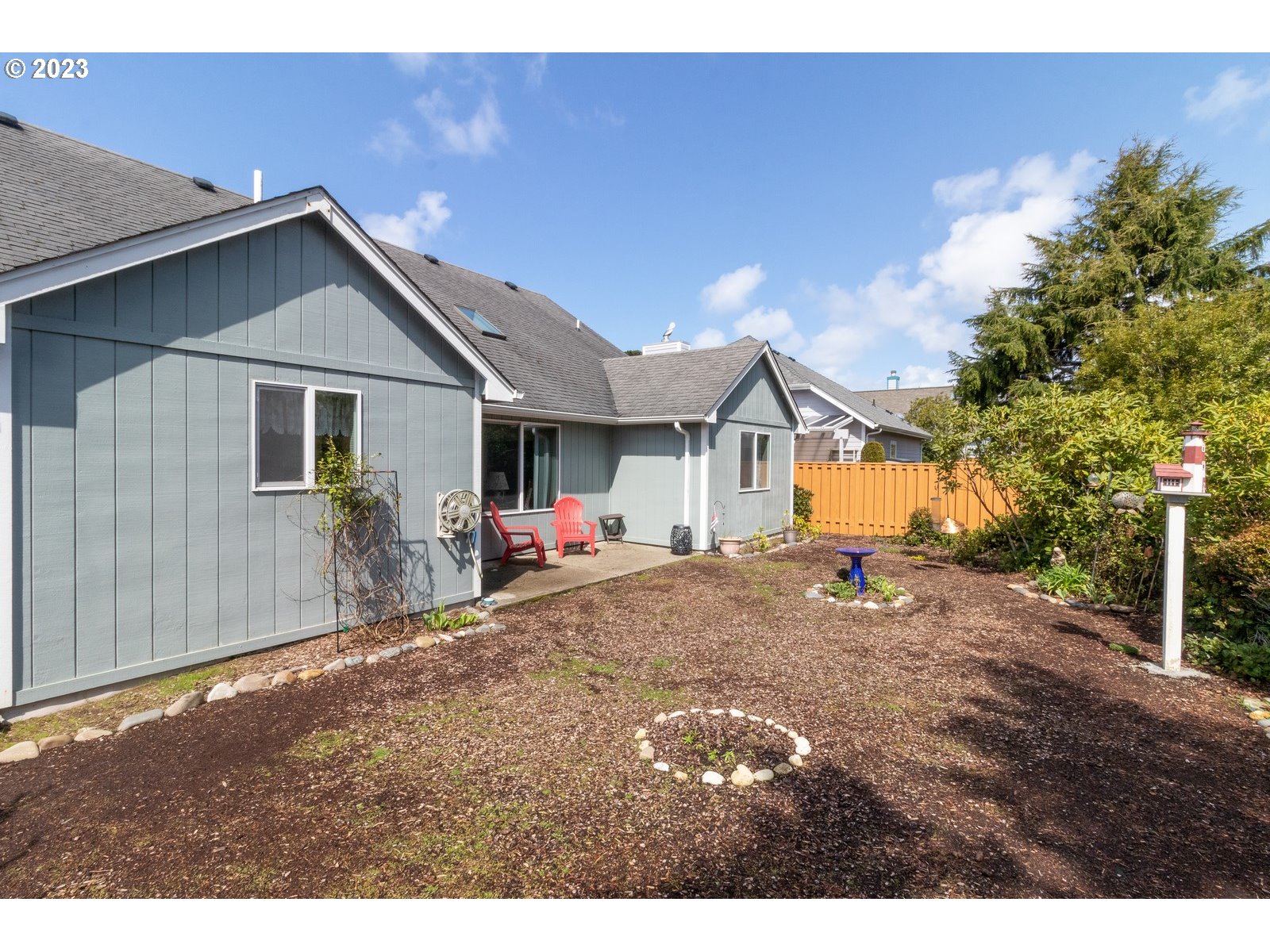 18 Mariners Lane Florence, OR 97439 - Photo 28 of 28 a view of a house with a yard and tree