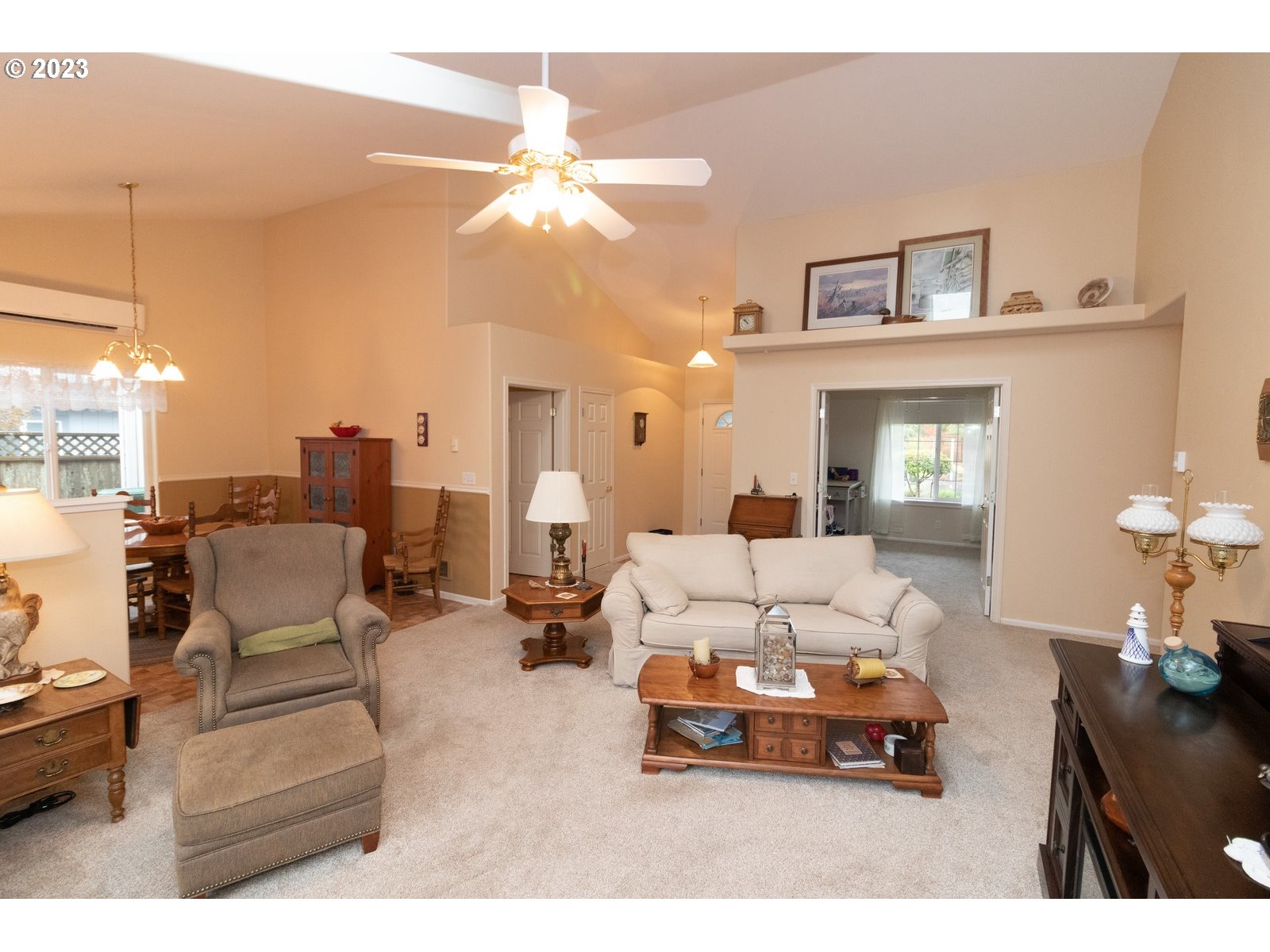 18 Mariners Lane Florence, OR 97439 - Photo 6 of 28 a living room with furniture a chandelier and a dining table