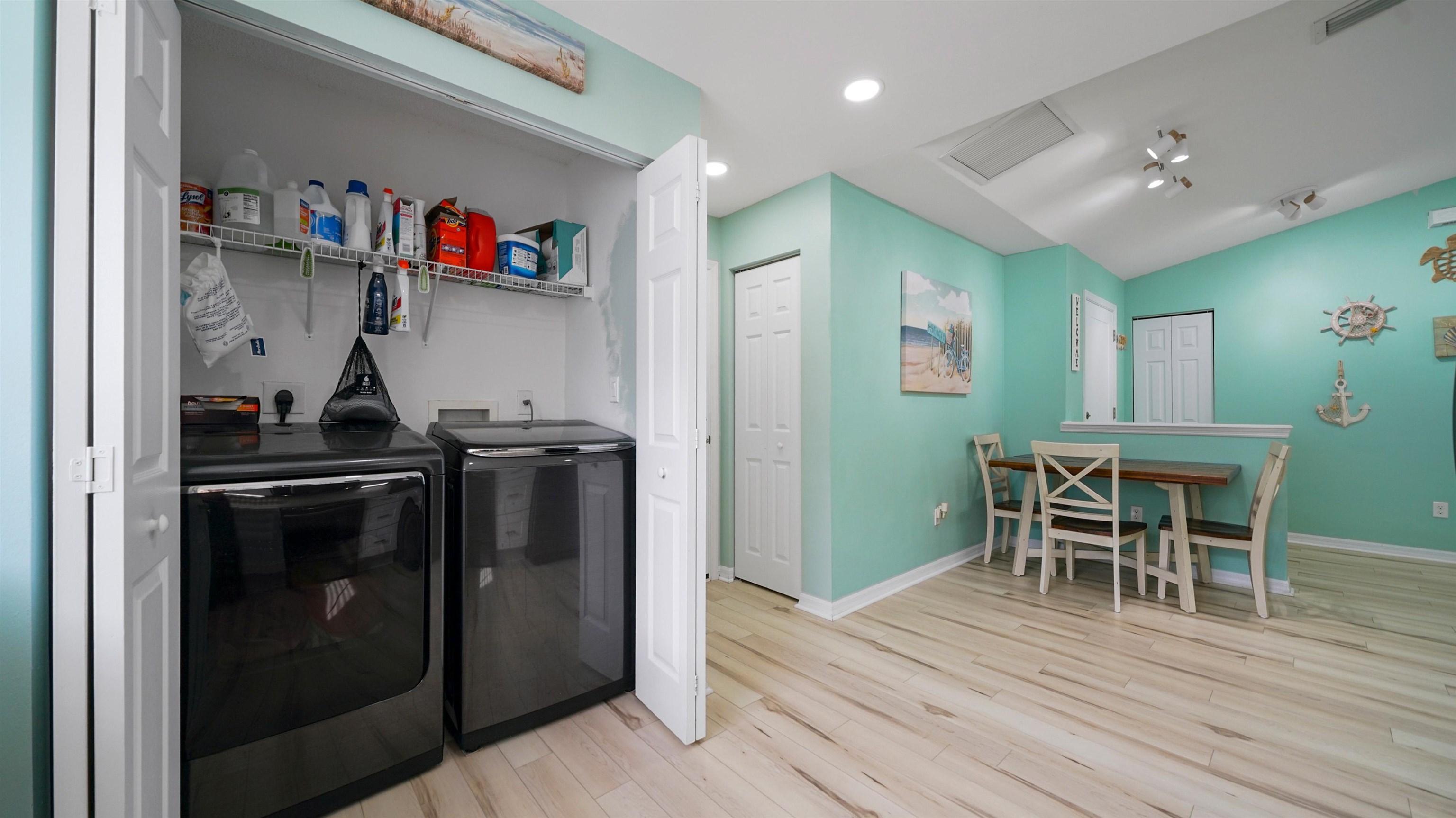 321 West Jayce Way St. Augustine, FL 32084 - Photo 13 of 34 a kitchen with a refrigerator and a dining table