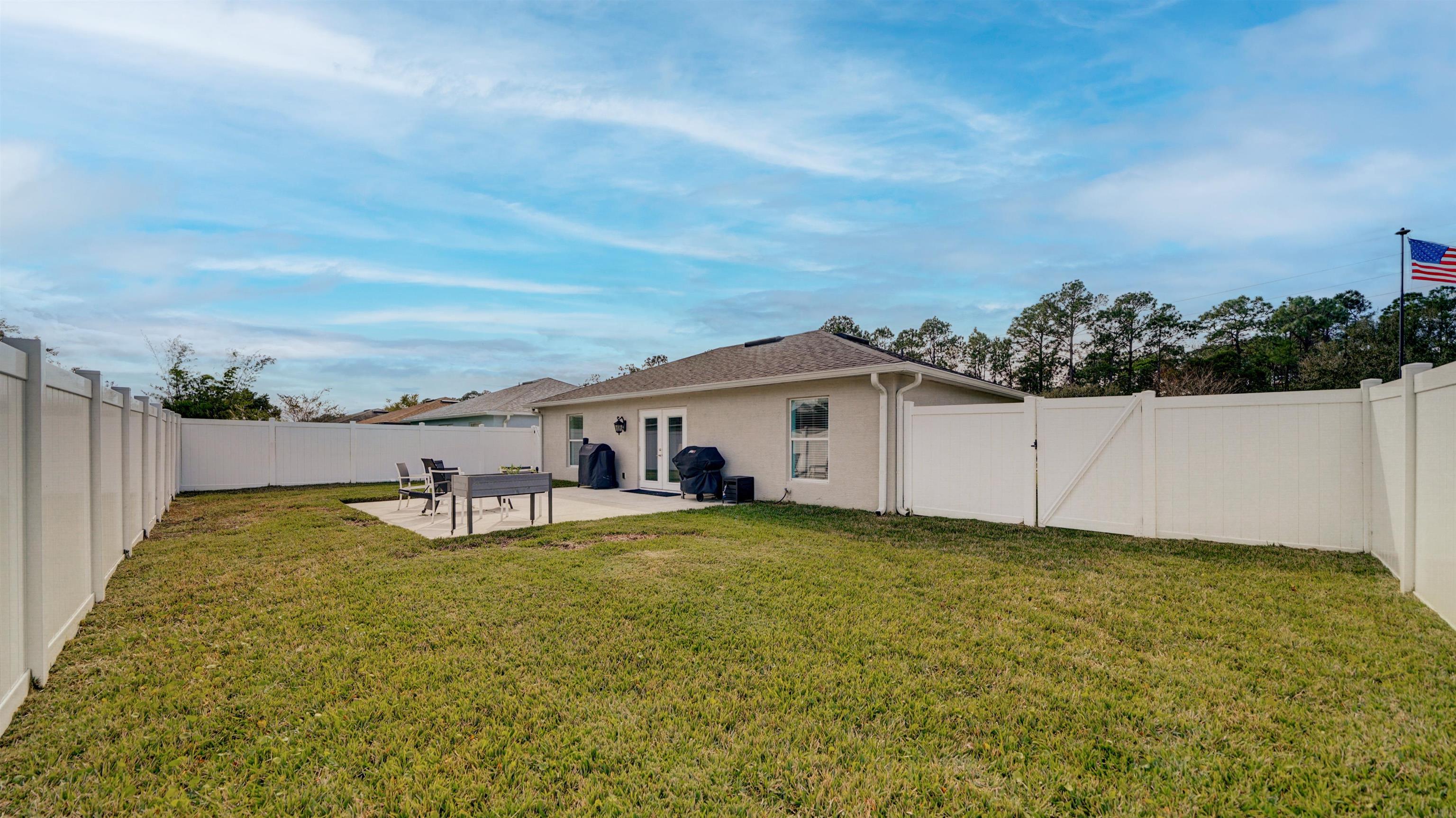 321 West Jayce Way St. Augustine, FL 32084 - Photo 26 of 34 a view of a house with a yard