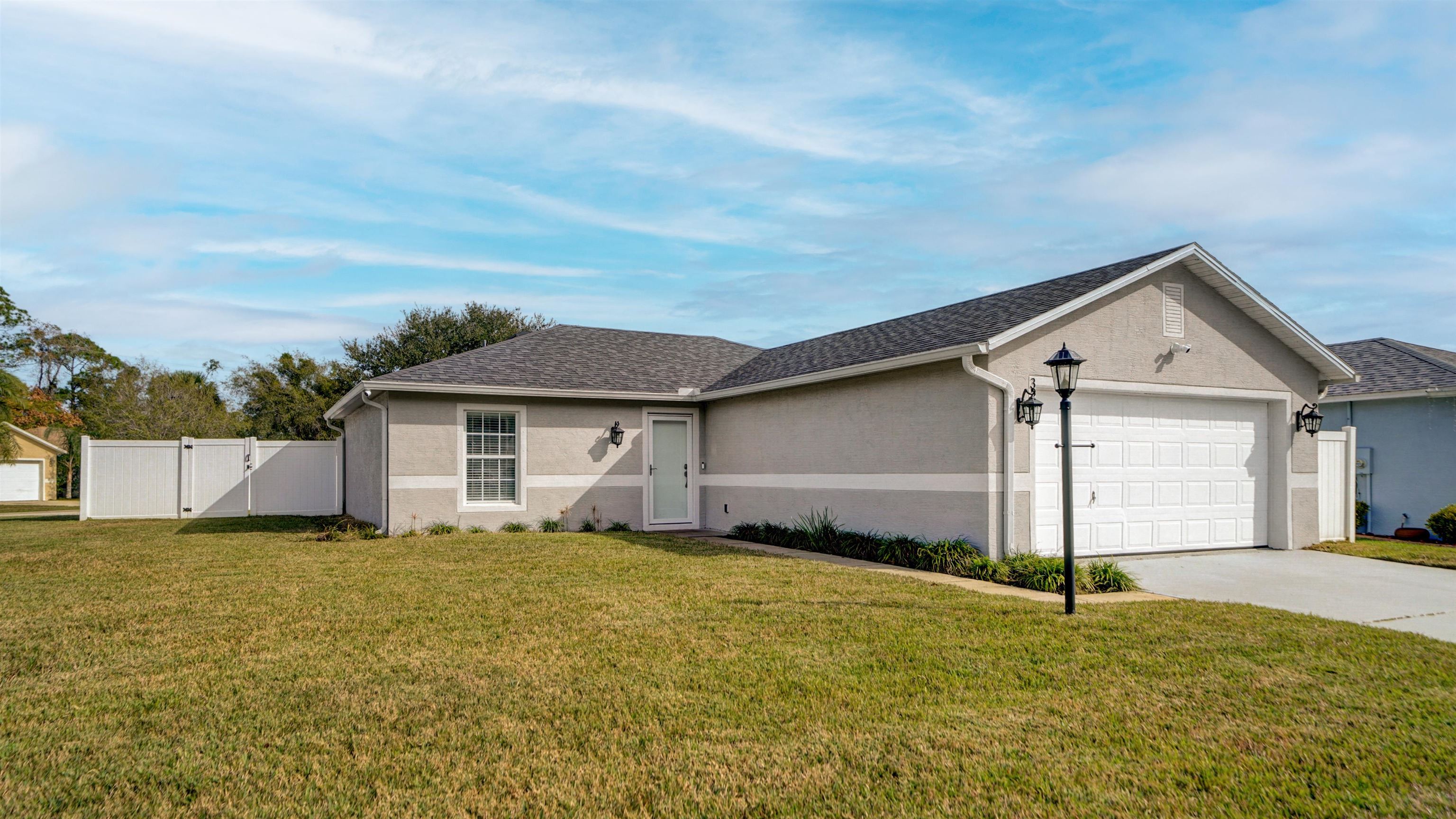 321 West Jayce Way St. Augustine, FL 32084 - Photo 34 of 34 a view of a house with a yard