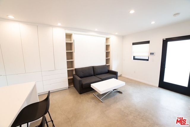a stove top oven sitting inside of a kitchen