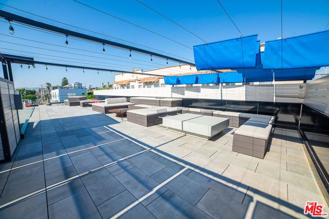 a view of a terrace with seating area