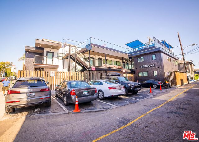 a view of a chairs and tables in patio