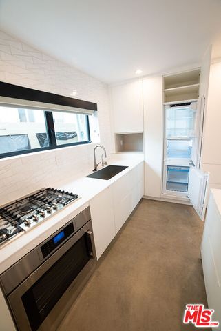 a room with a bed and a chair