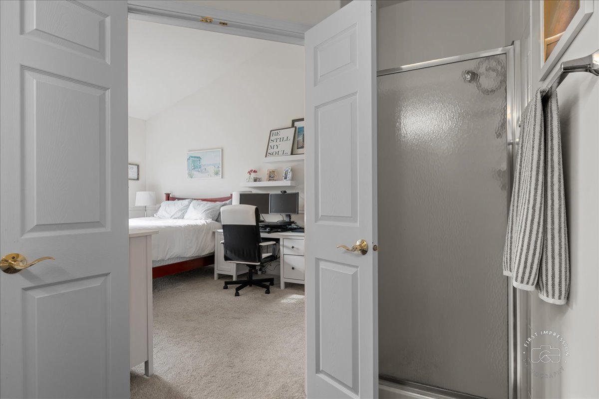 263 Lillian Court Geneva, IL 60134 - Photo 15 of 27 a room that has a bed and a chair in it