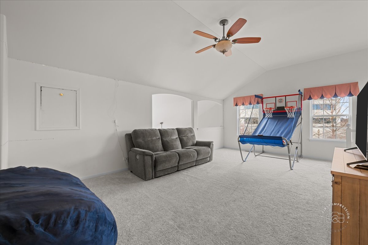 263 Lillian Court Geneva, IL 60134 - Photo 17 of 27 a living room with furniture and a ceiling fan