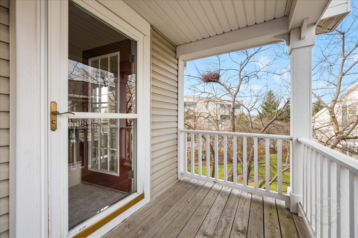 263 Lillian Court Geneva, IL 60134 - Photo 21 of 27 a view of a balcony with wooden floor