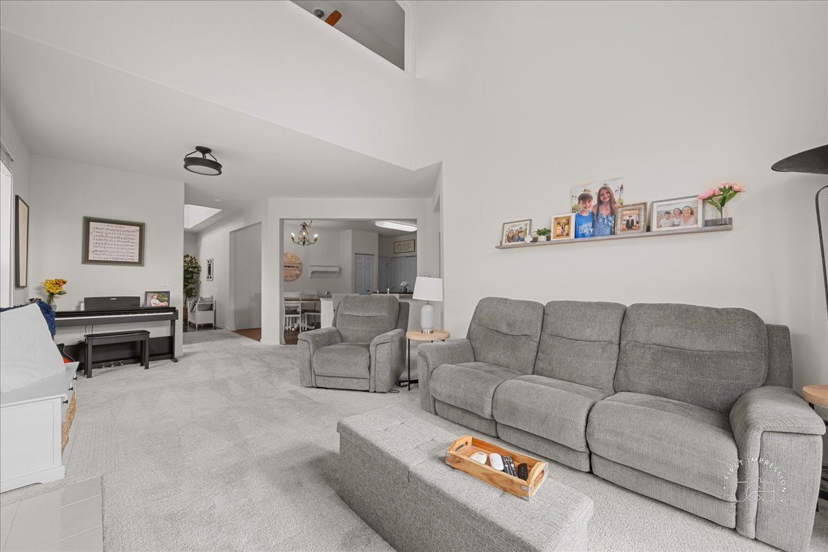 263 Lillian Court Geneva, IL 60134 - Photo 7 of 27 a living room with furniture and a couch