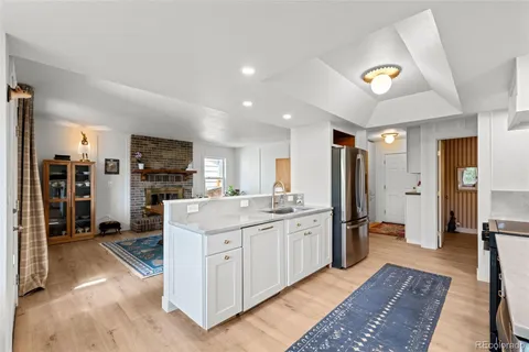 a large kitchen with a lot of counter space and refrigerator
