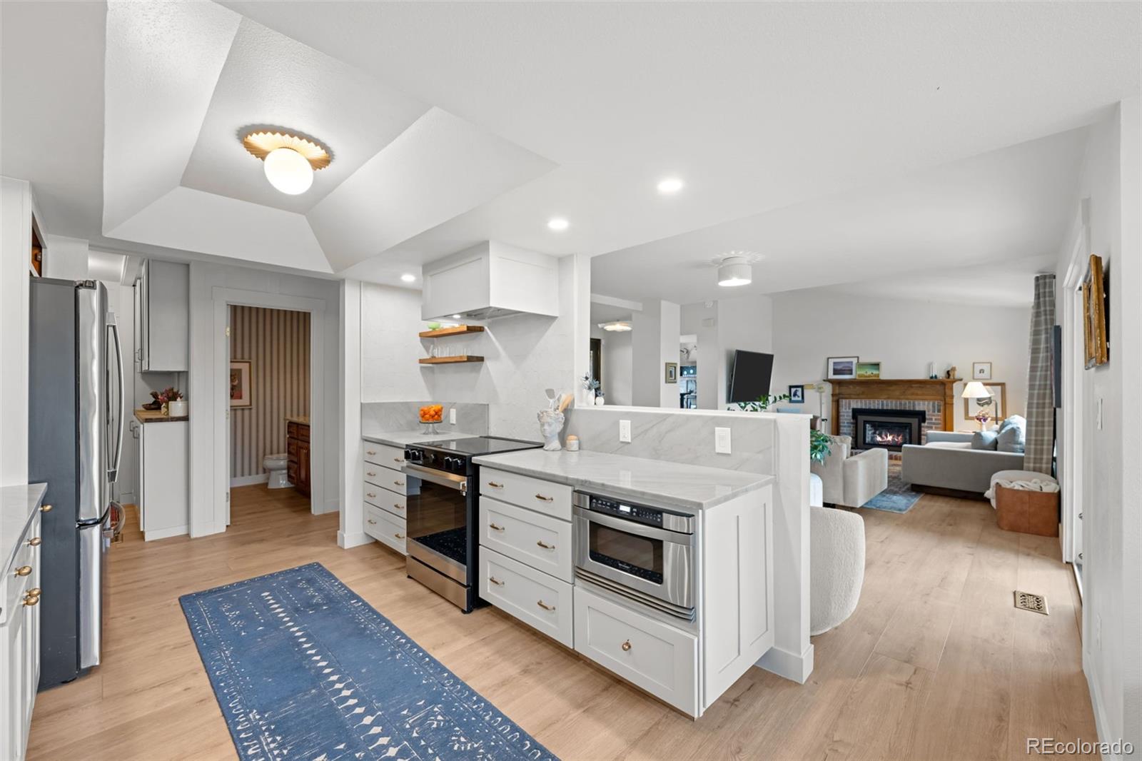 755 Old Stone Drive Highlands Ranch, CO 80126 - Photo 12 of 44 a kitchen with a stove and a refrigerator