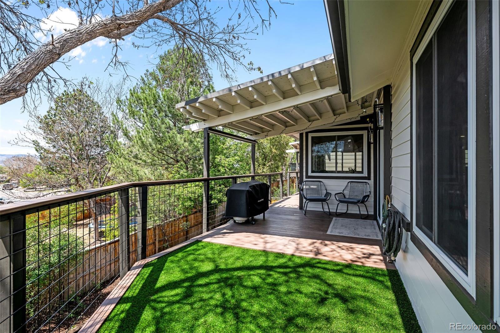 755 Old Stone Drive Highlands Ranch, CO 80126 - Photo 20 of 44 a view of a porch with furniture and garden