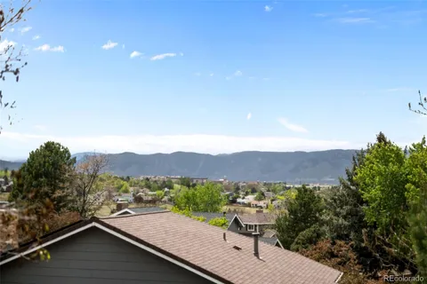a view of a terrace with a garden and mountain view
