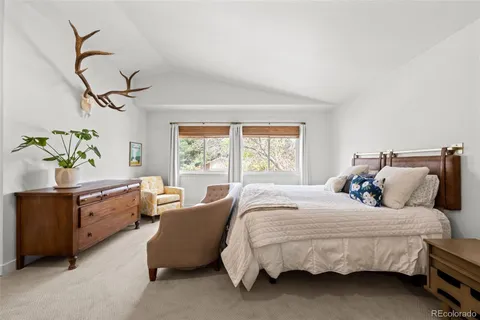 a bed room with a bed and a potted plant