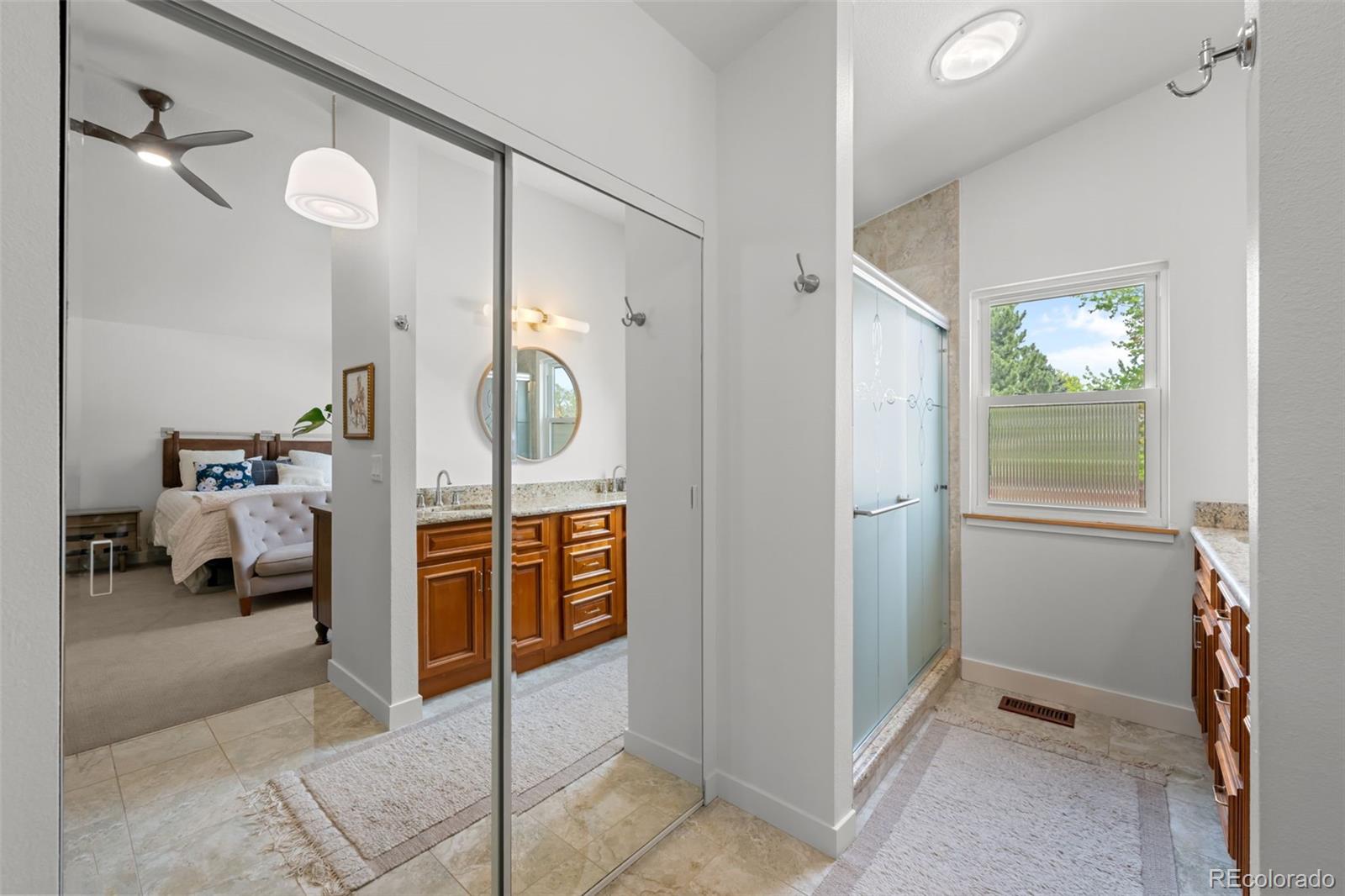 755 Old Stone Drive Highlands Ranch, CO 80126 - Photo 24 of 44 a bedroom with a bed and a mirror