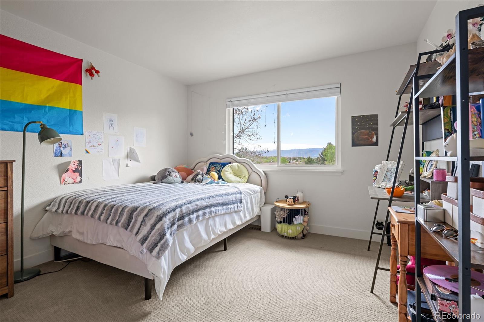755 Old Stone Drive Highlands Ranch, CO 80126 - Photo 26 of 44 a bedroom with a bed and a window