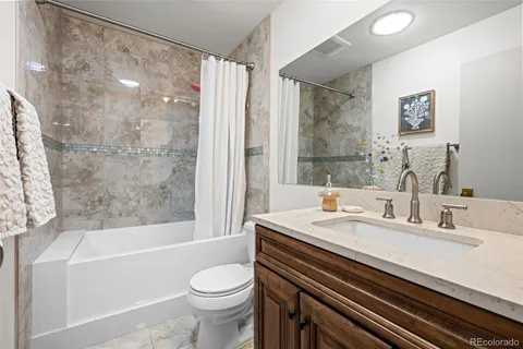 a bathroom with a sink a toilet and a bathtub