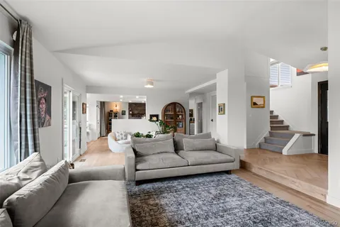 a living room with furniture and a rug
