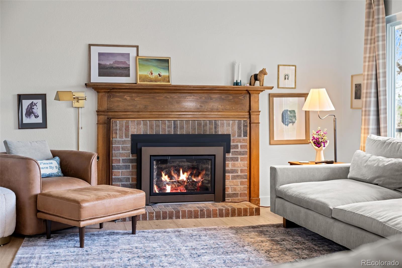 755 Old Stone Drive Highlands Ranch, CO 80126 - Photo 10 of 44 a living room with furniture and a fireplace