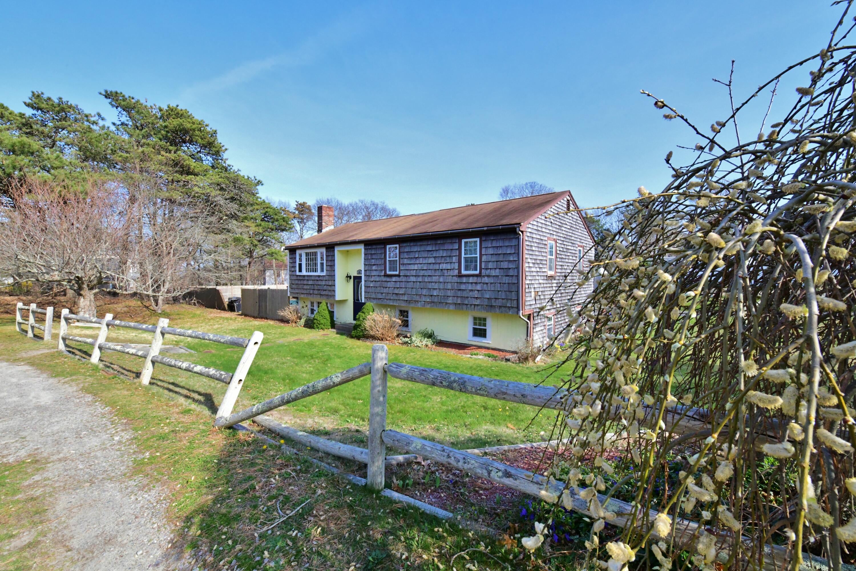 65 Siasconset Drive Sagamore Beach, MA 02562 - Photo 12 of 53 a view of a backyard with a small cabin
