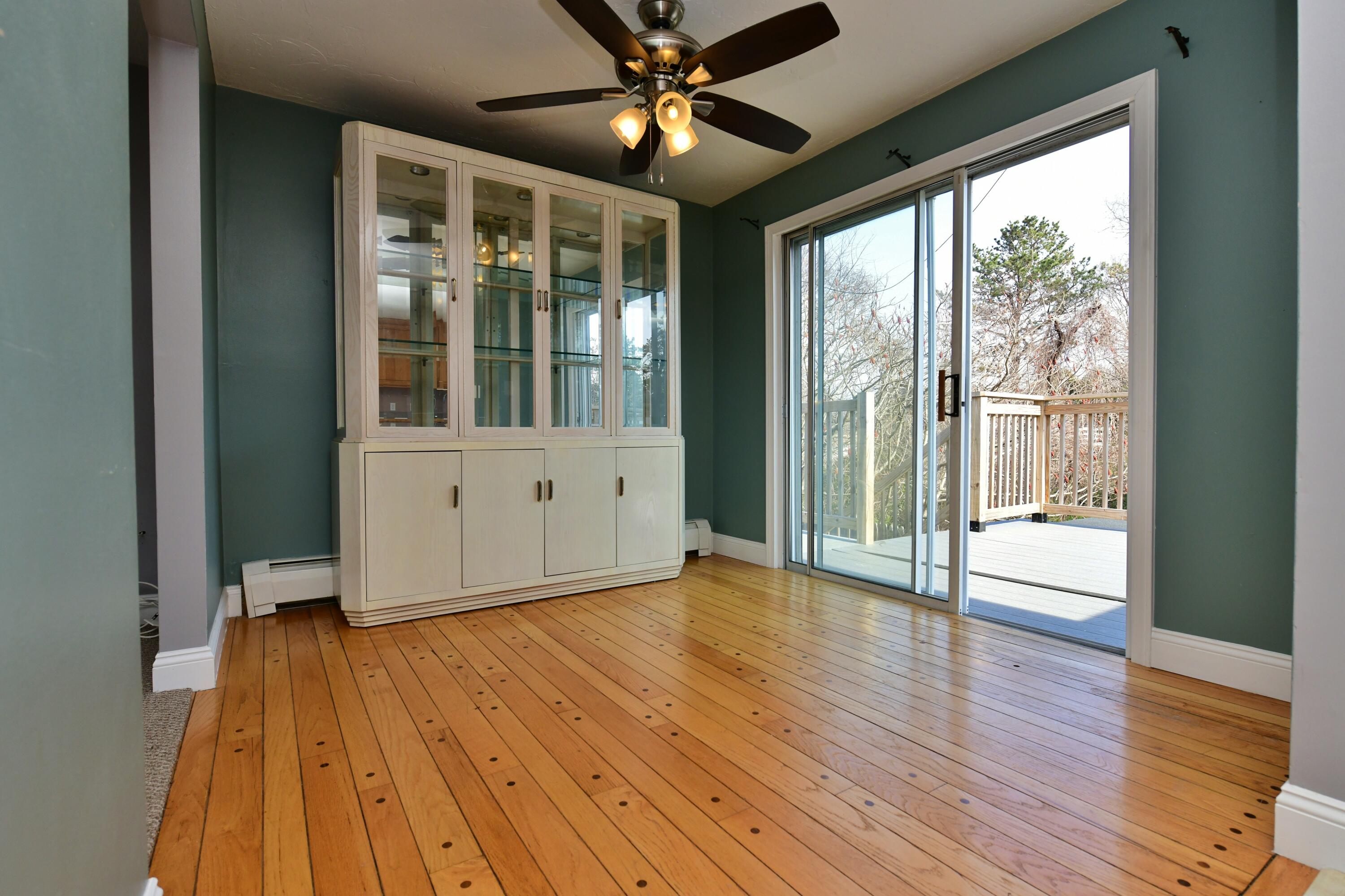 65 Siasconset Drive Sagamore Beach, MA 02562 - Photo 14 of 53 a view of an empty room with wooden floor and a window
