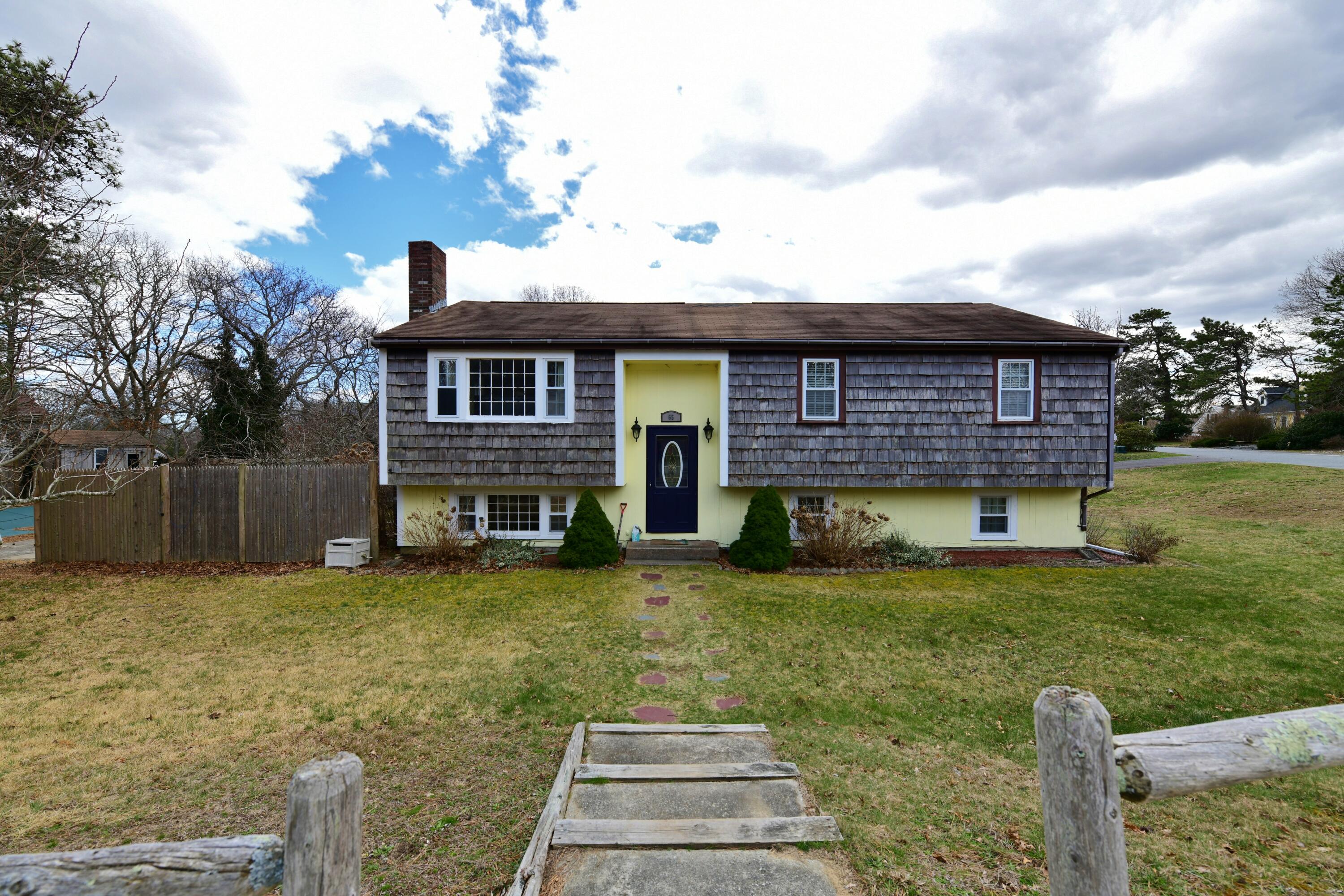 65 Siasconset Drive Sagamore Beach, MA 02562 - Photo 2 of 53 a view of a house with a yard and sitting area