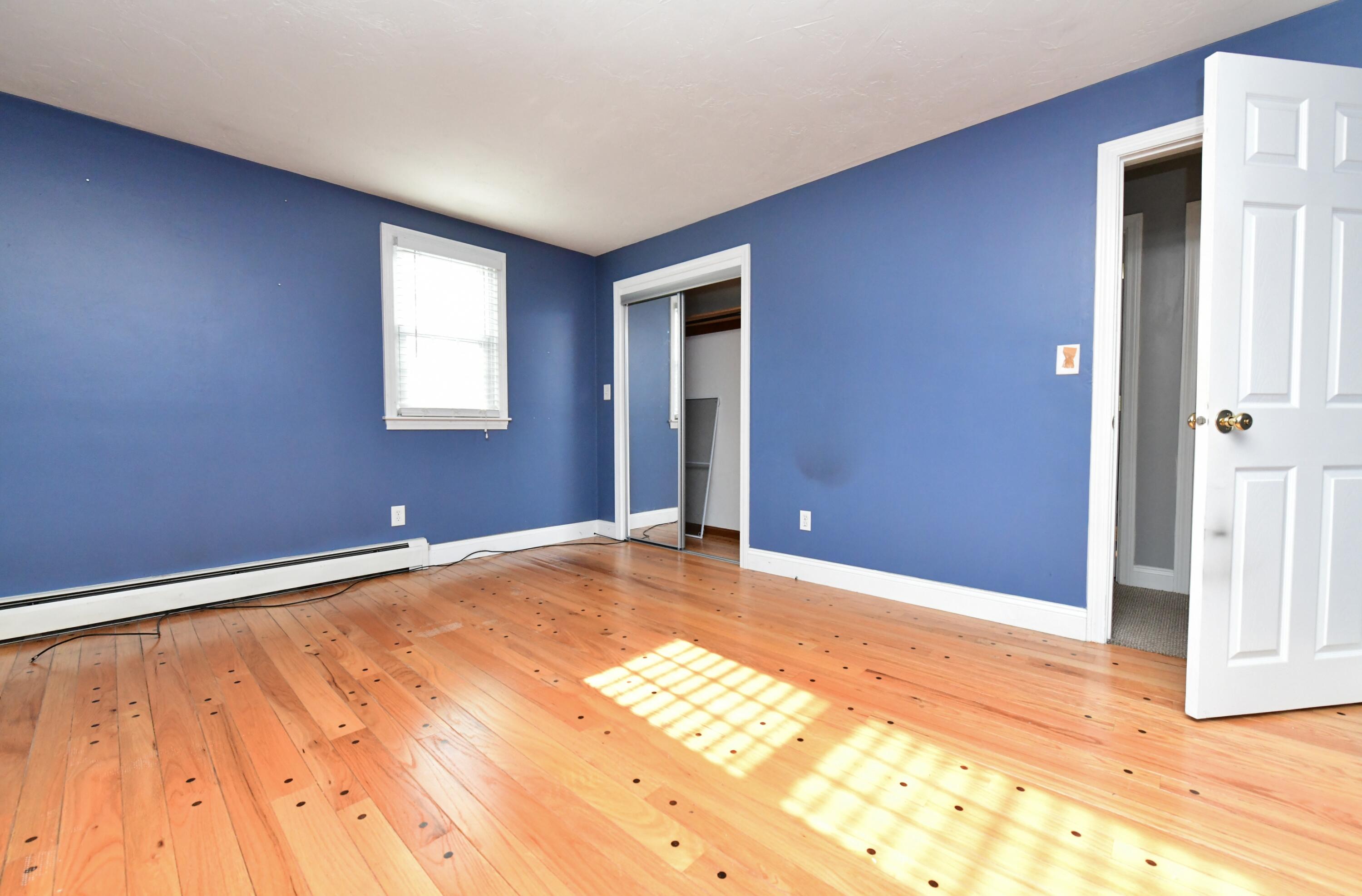 65 Siasconset Drive Sagamore Beach, MA 02562 - Photo 22 of 53 a view of an empty room with wooden floor and a window