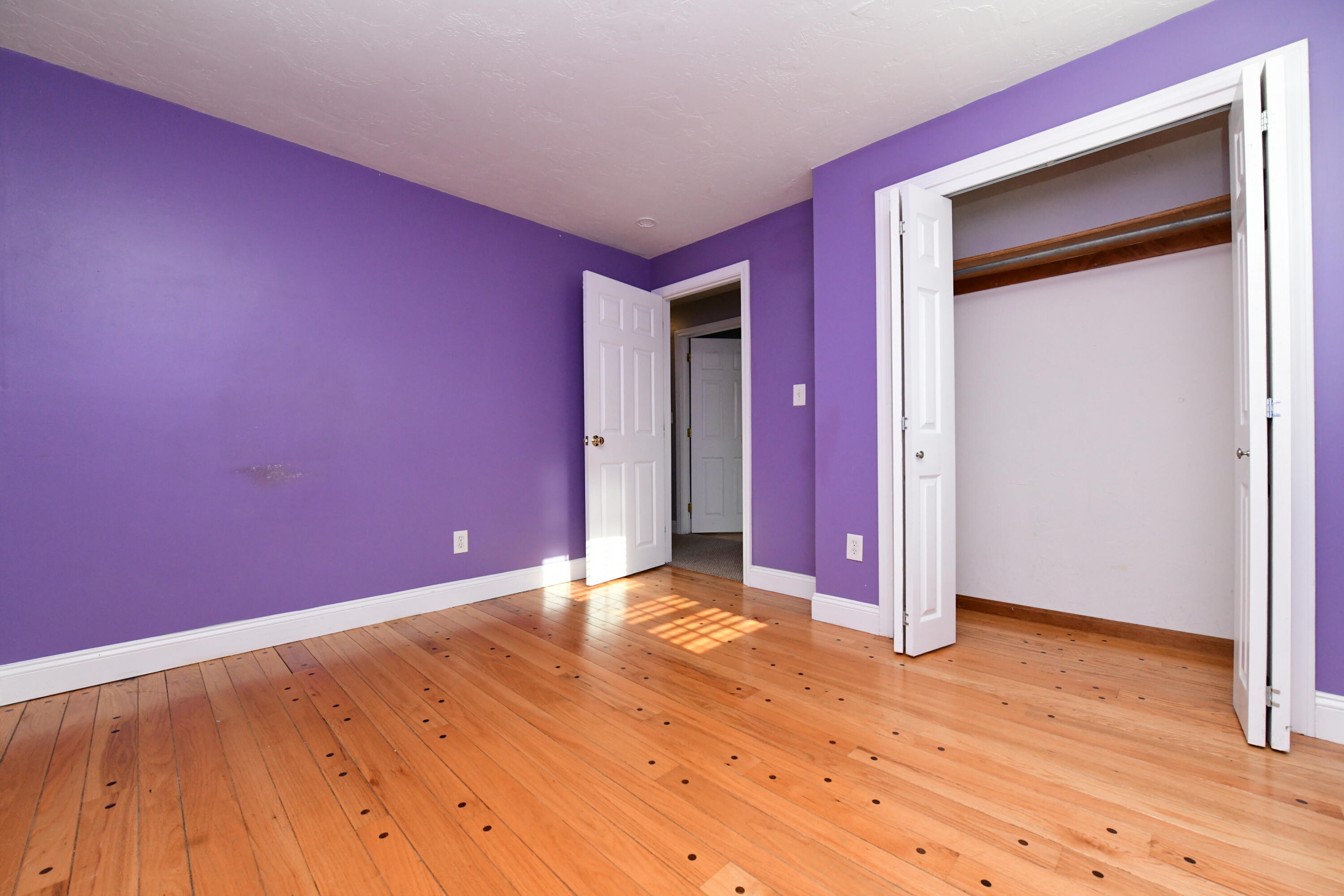 65 Siasconset Drive Sagamore Beach, MA 02562 - Photo 25 of 53 a view of a room with wooden floor and a window