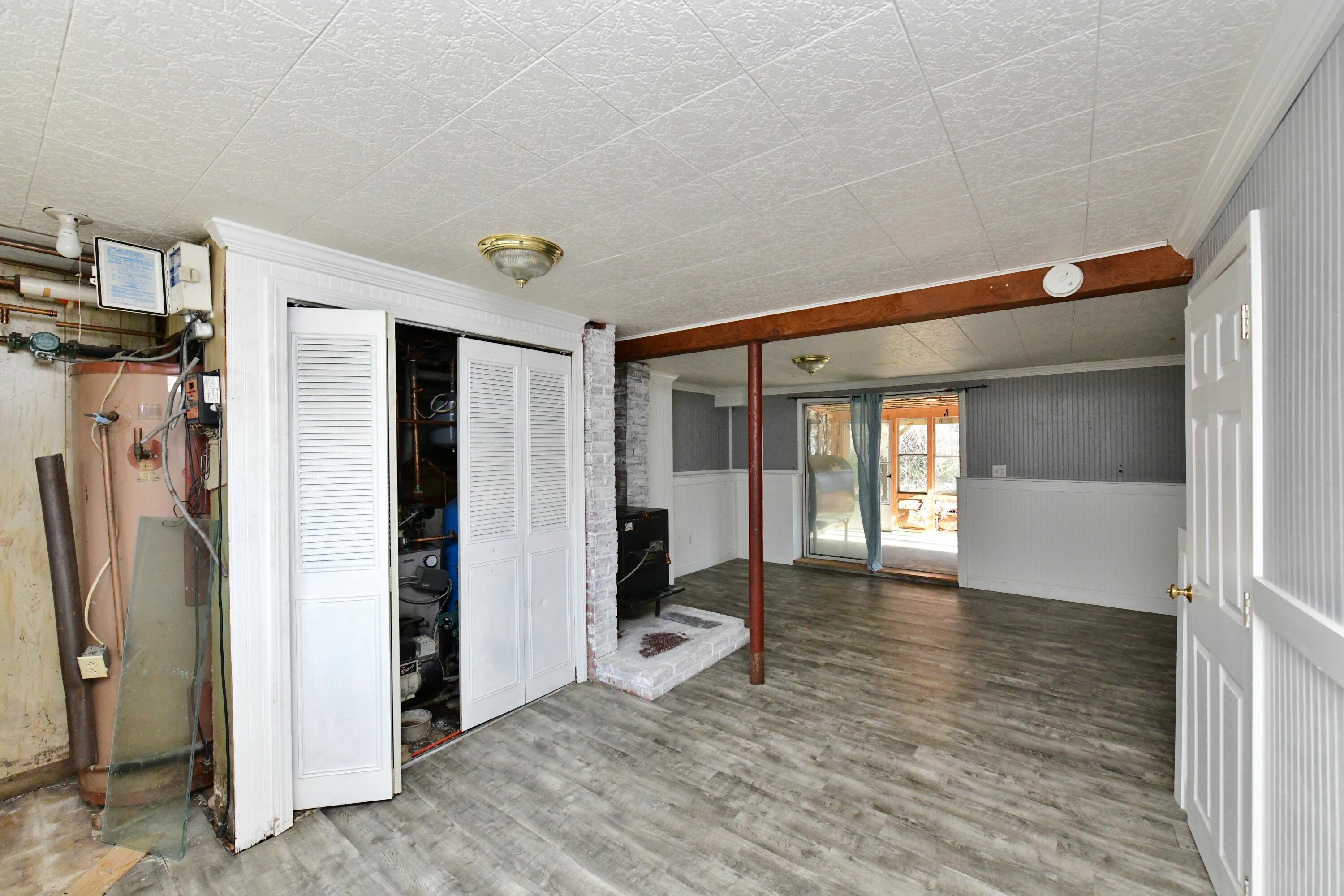 65 Siasconset Drive Sagamore Beach, MA 02562 - Photo 30 of 53 a living room with furniture and a window