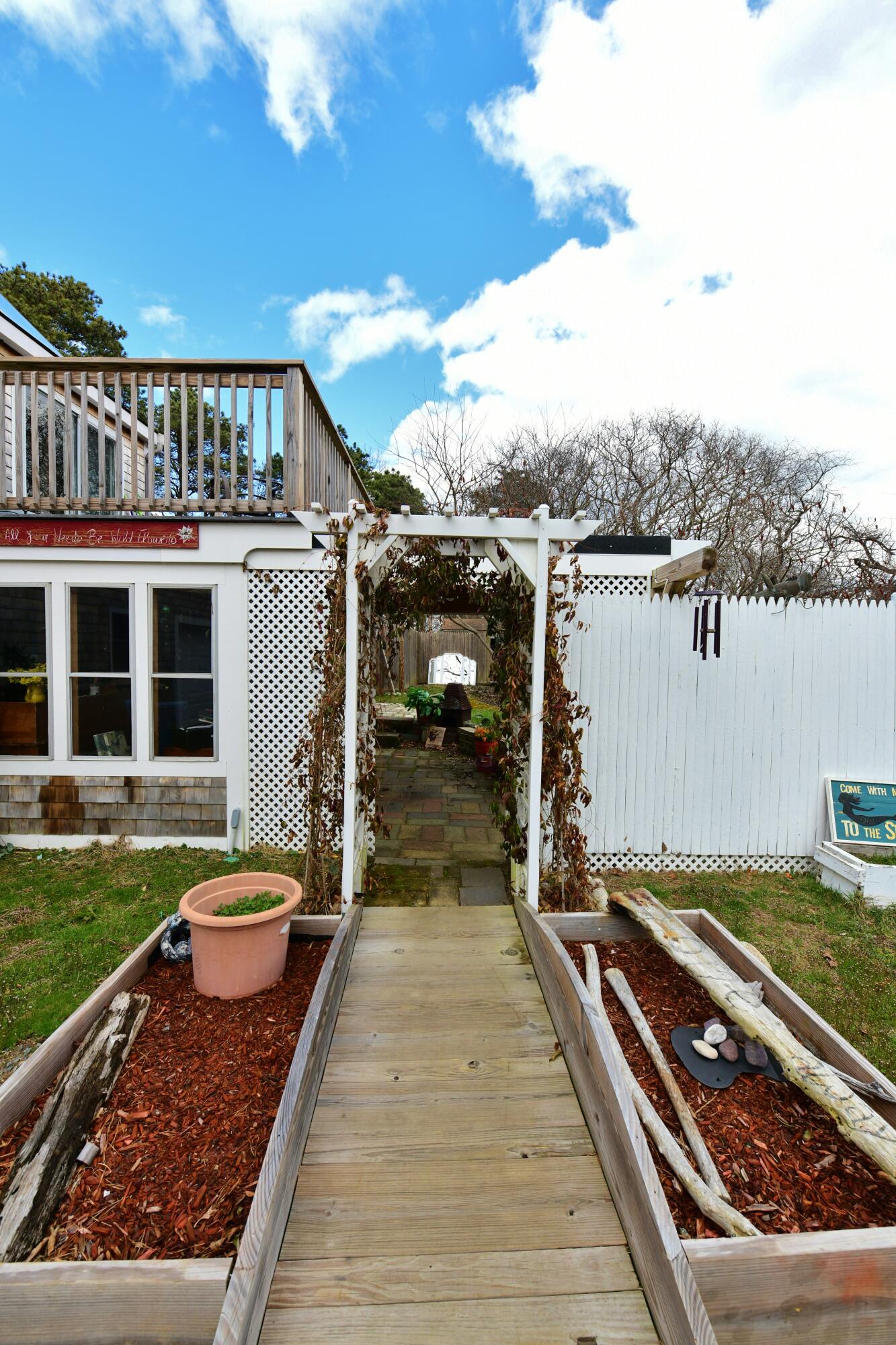 65 Siasconset Drive Sagamore Beach, MA 02562 - Photo 3 of 53 a view of a backyard with sitting area